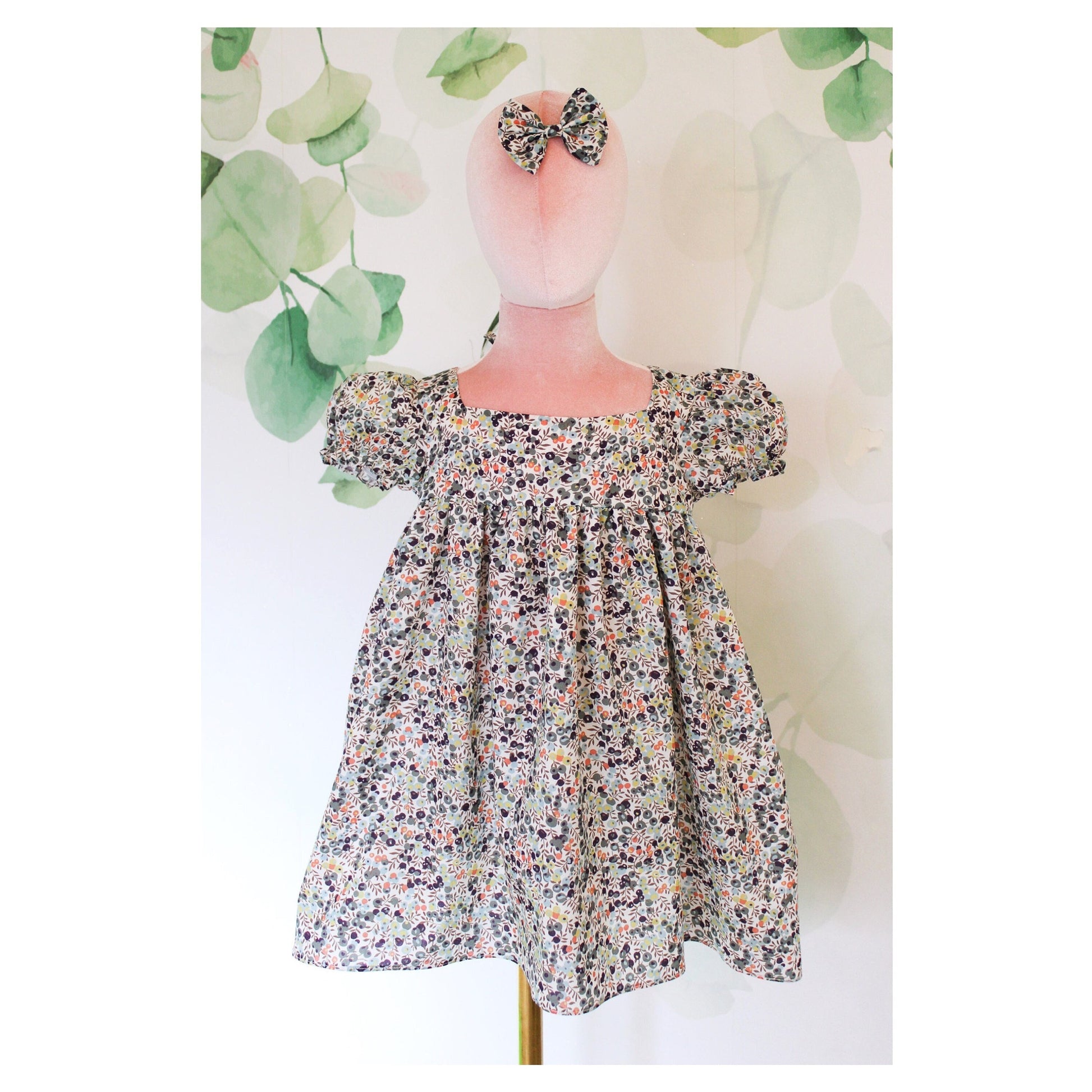 Liberty London dress for little girl with Square Neck and Short Puffy Sleeves.