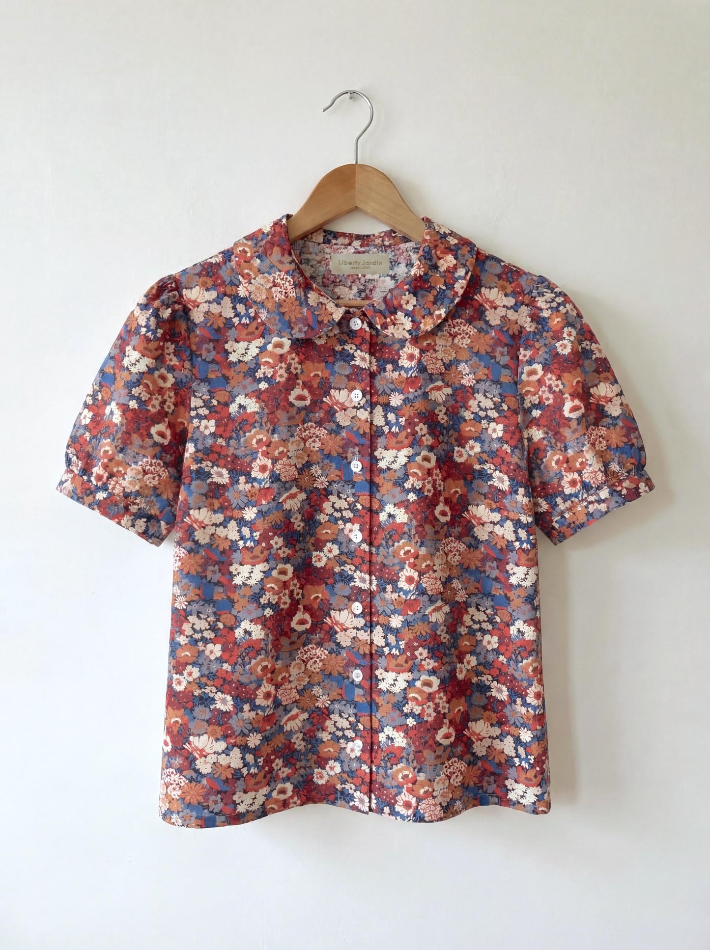 Sleeveless Liberty Woman Top: Ruffle Peter Pan Collar, Floral Print Blouse